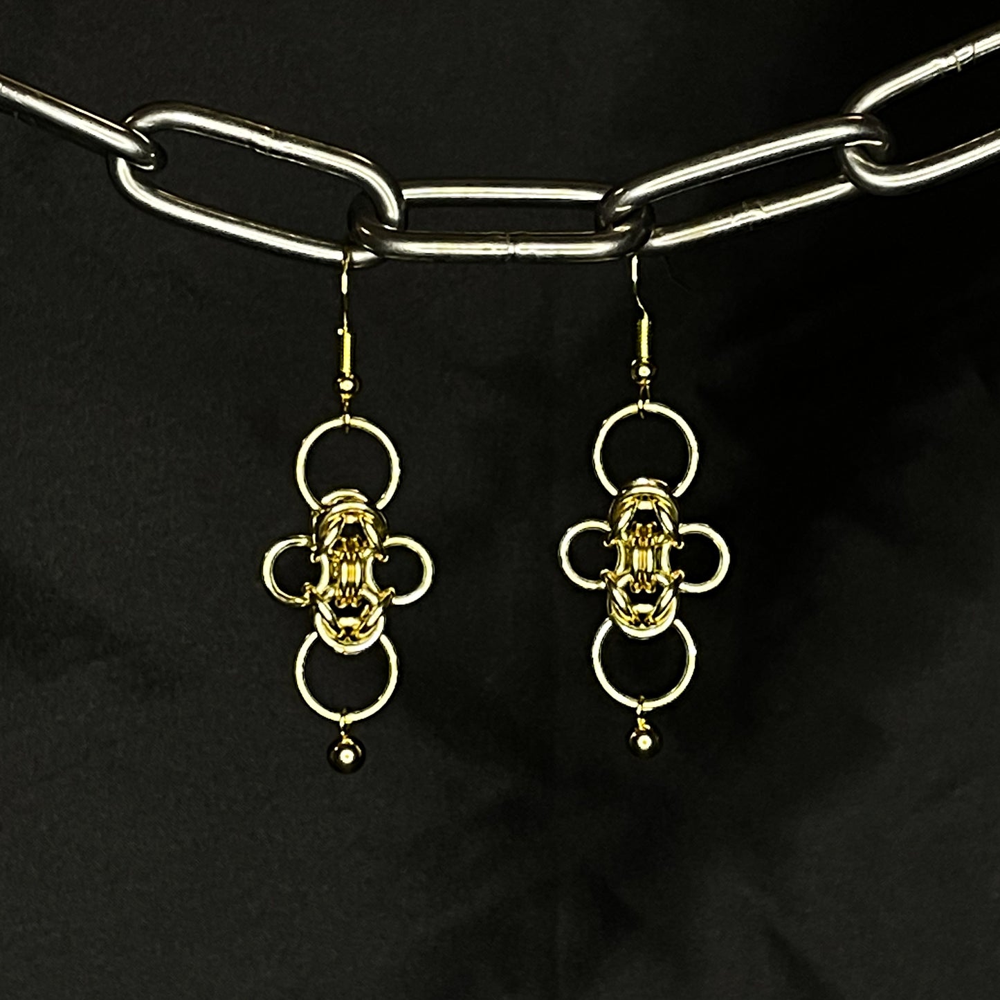 the clover earrings in brass