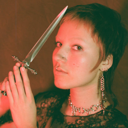 the half persian dagger earrings