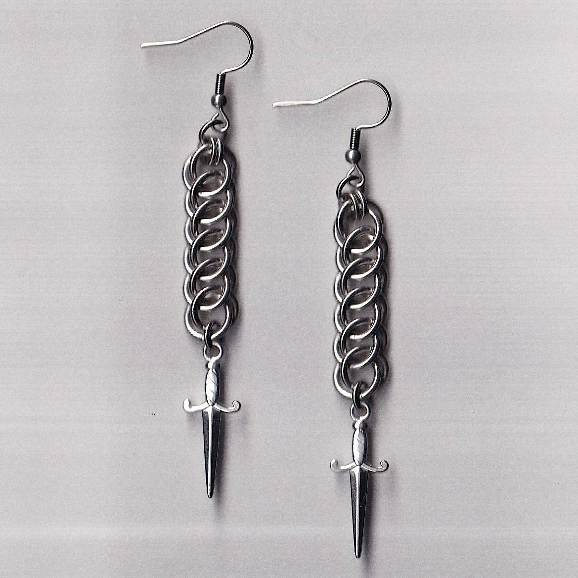 the half persian dagger earrings